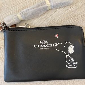 Coach Snoopy wristlet.